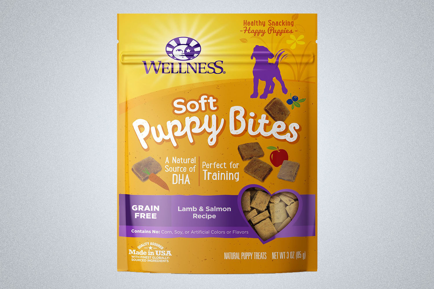 a package of Wellness puppy bite dog treats on a grey background