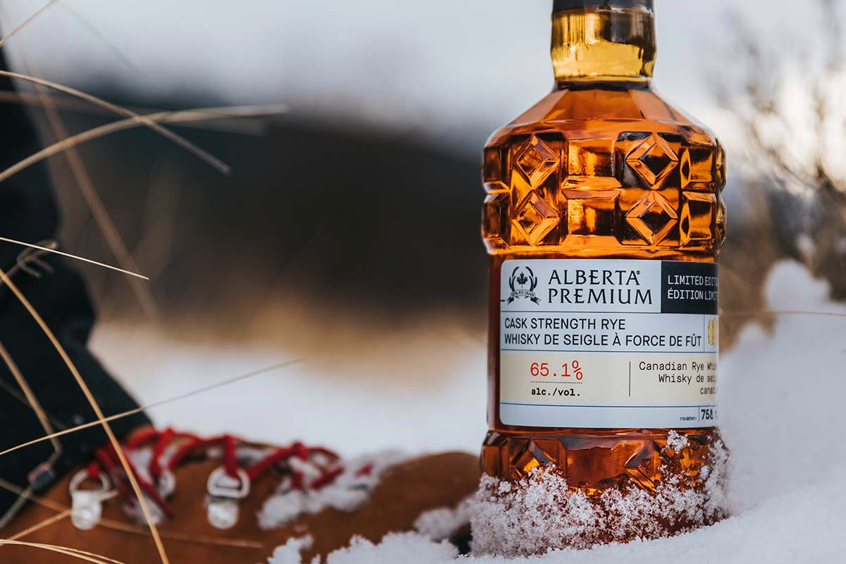 A bottle of Alberta Distillers Cask Strength Rye in the snow