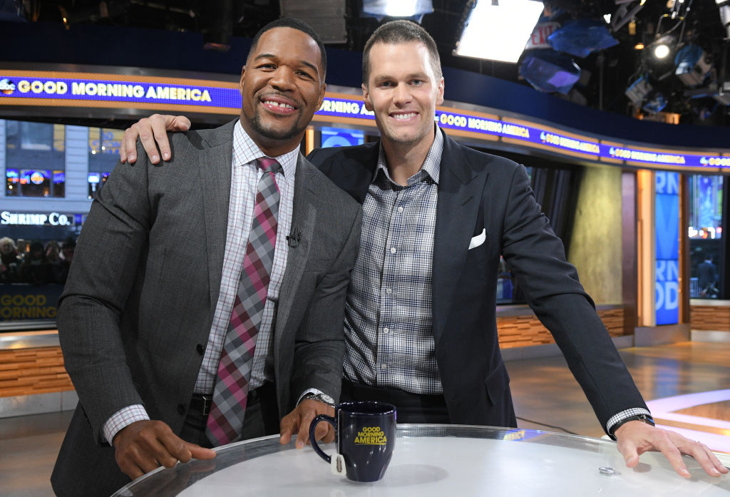 Tom Brady with Michael Strahan on "Good Morning America" in 2018. Their production company, Religion of Sports, just raised $50 million in 2022.