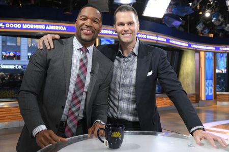 Tom Brady with Michael Strahan on "Good Morning America" in 2018. Their production company, Religion of Sports, just raised $50 million in 2022.