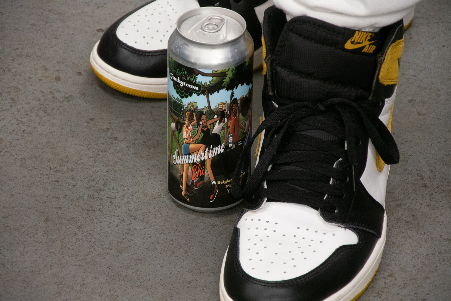 Summertime Chi, the newest beer from Funkytown Brewing in Chicago, in a can in between Nike sneakers