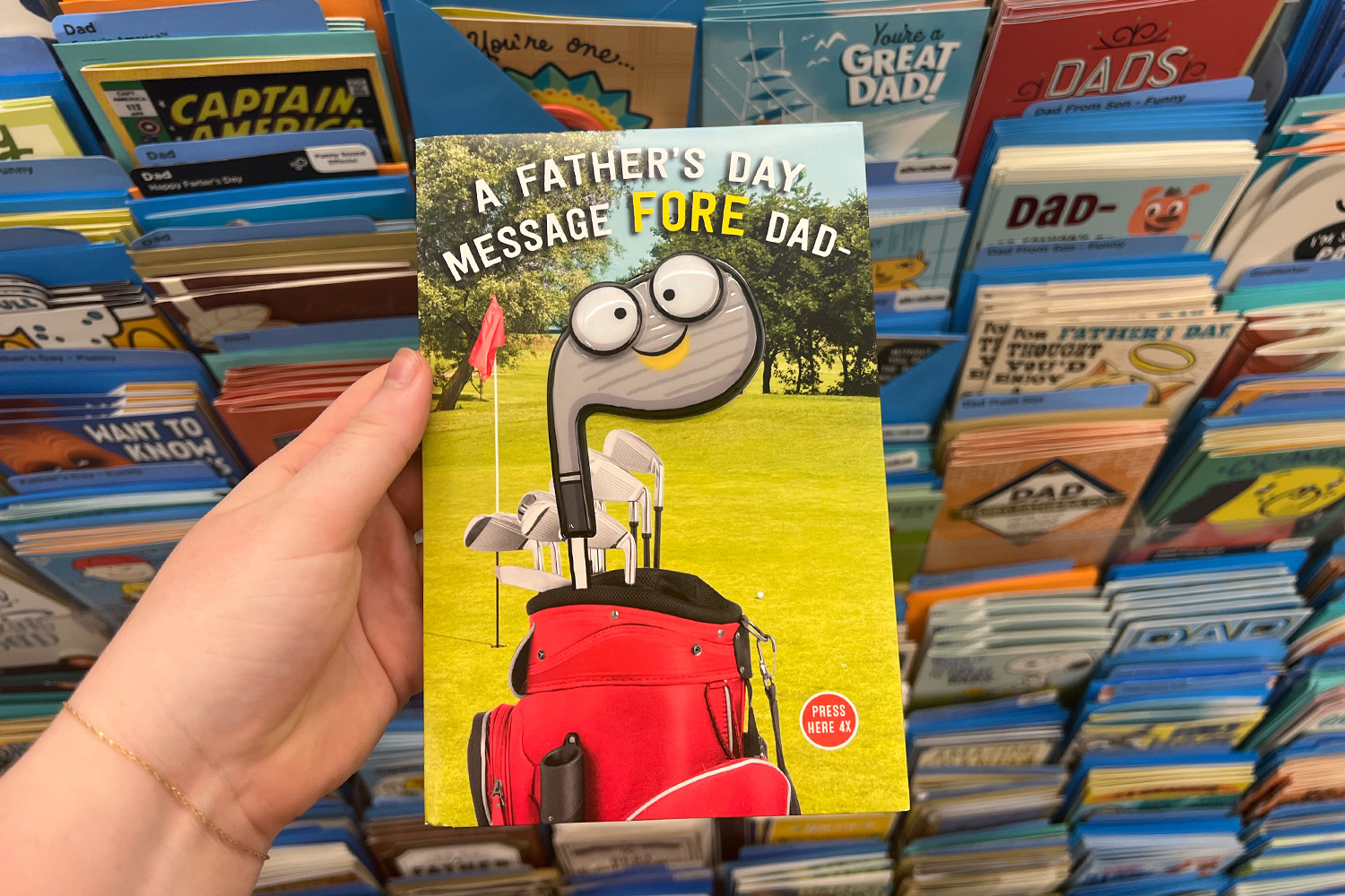 Father's Day card with a golf club with googly eyes on it.