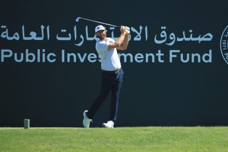 Dustin Johnson hits a tee-shot at the Saudi International in 2021