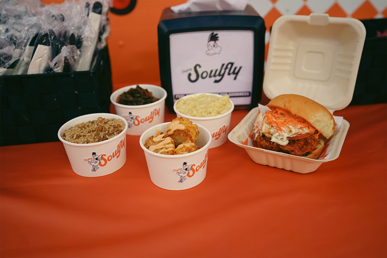 A spread of food on a table from Soulfly Chicken in Miami