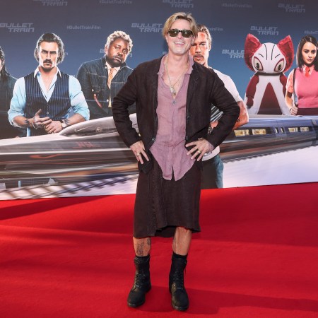 Brad Pitt at a premiere for Bullet Train in a man skirt, mauve button-up and loose blazer