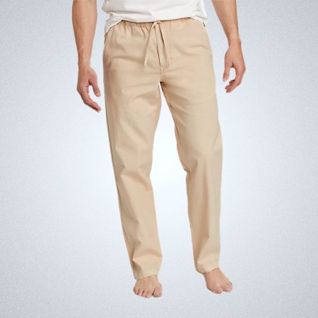 a model's lower half in a pair of beige Eddie Bauer Hemplify drawstring pants on a grey background