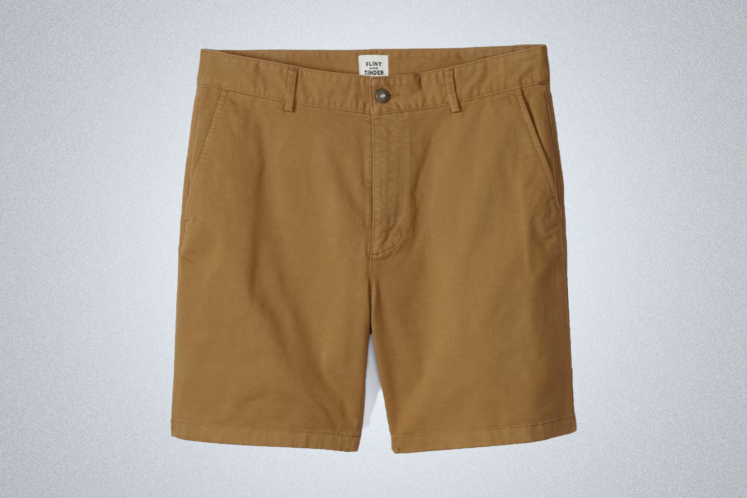 a pair of tan 7" chino shorts from Flint and Tinder on a grey background