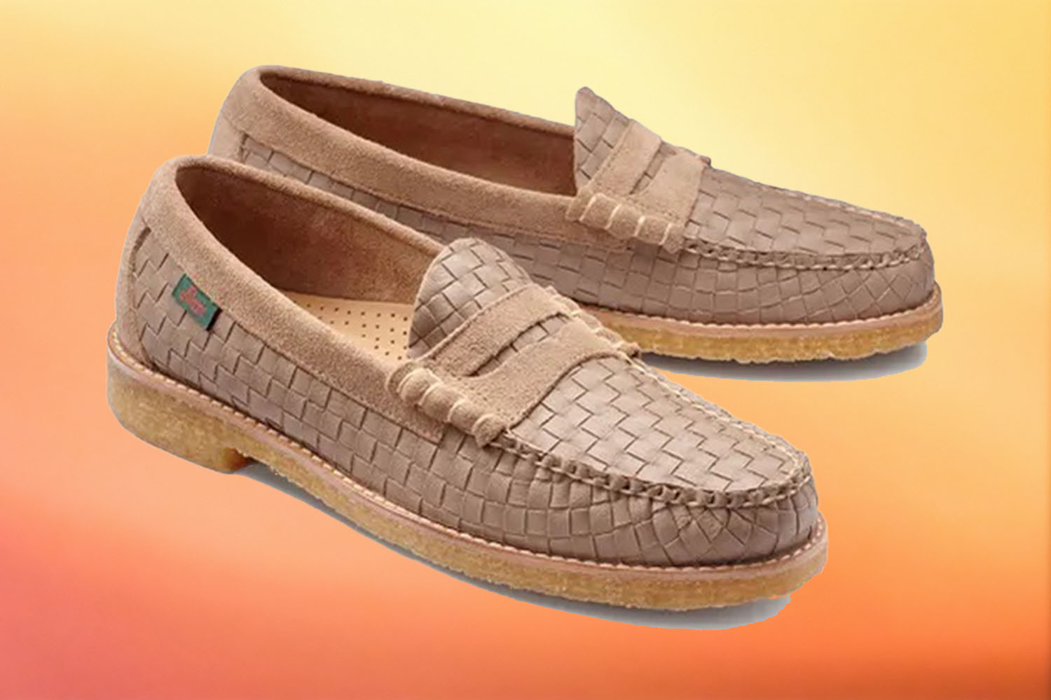 a pair of woven crepe loafers from G.H. Bass on a yellow-orange gradient background
