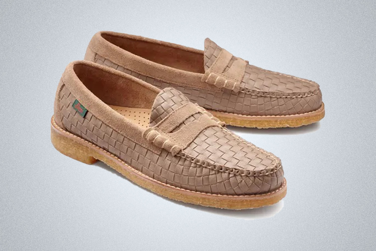 a pair of woven tan loafers from G.H. Bass on a grey background