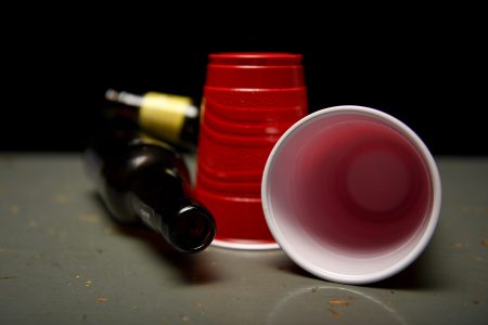 Beer bottles and red Solo cups