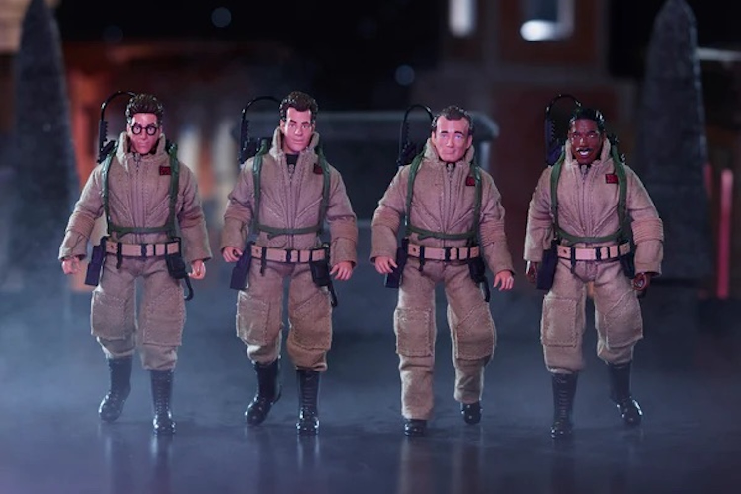 four ghostbusters actions figures from Hasbro on a spooky background