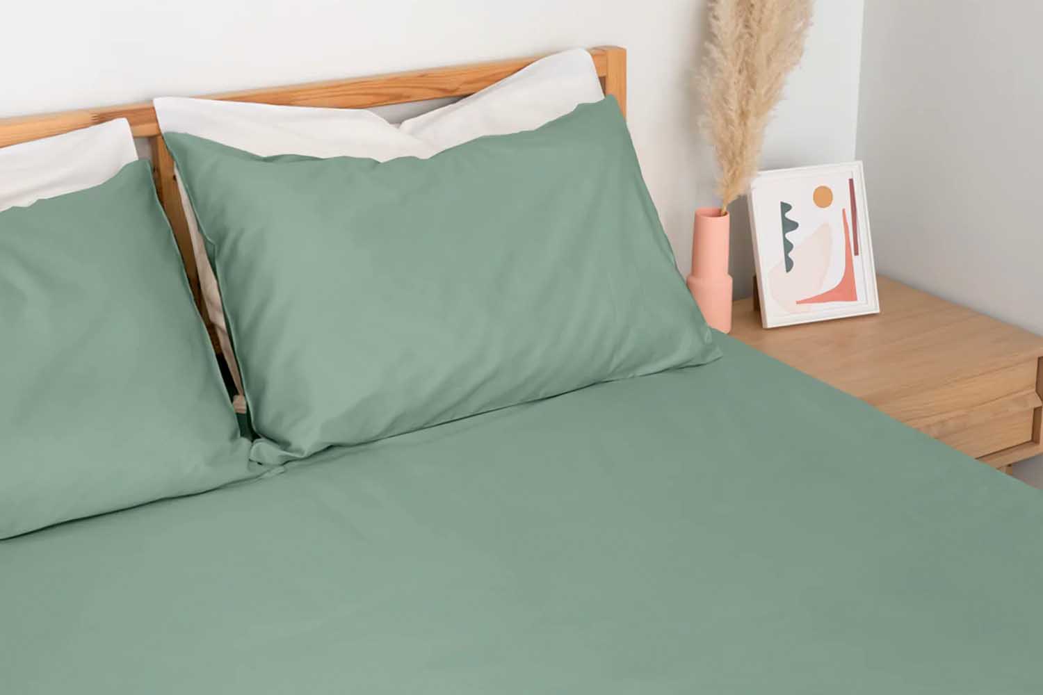 A bed outfitted with Homebird Cool and Crisp Percale Fitted Sheet Set