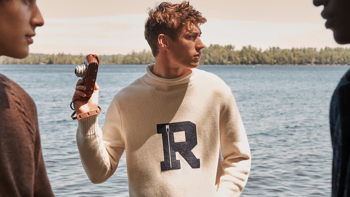 a model wearing the new J.Crew Fall 2022 collection in front of a lake
