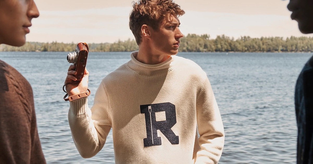 a model wearing the new J.Crew Fall 2022 collection in front of a lake