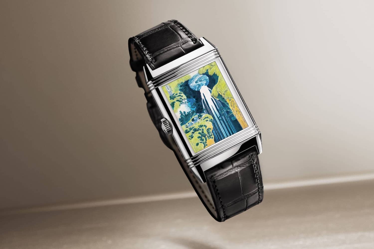 a fancy image-faced Jaeger-LeCoultre watch on a light background