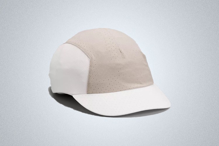 a grey and white running hat from lululemon on a grey background