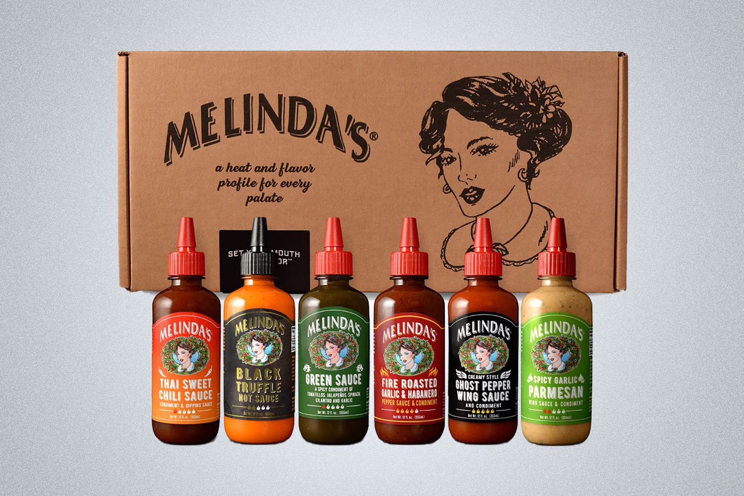 a collage of four different hot sauces from Melinda's on a grey background