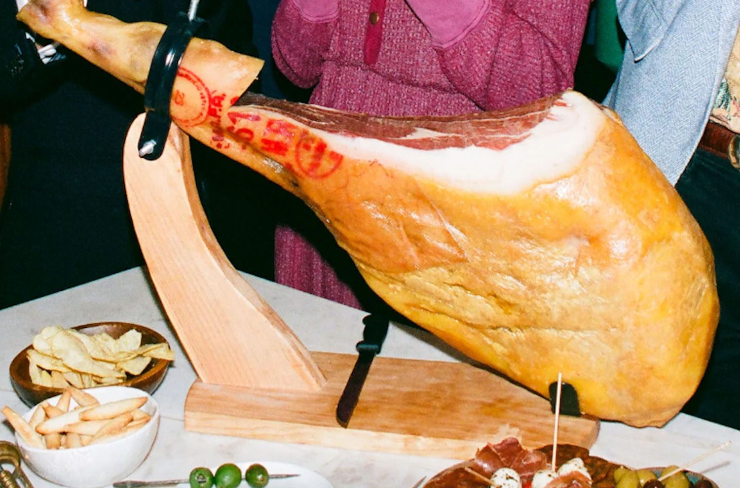a leg of ham on a festive table