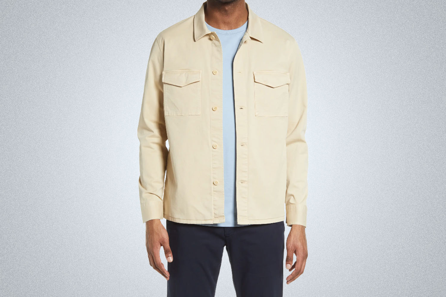 a model in a NN07 cream-colored shirt jacket on a grey background