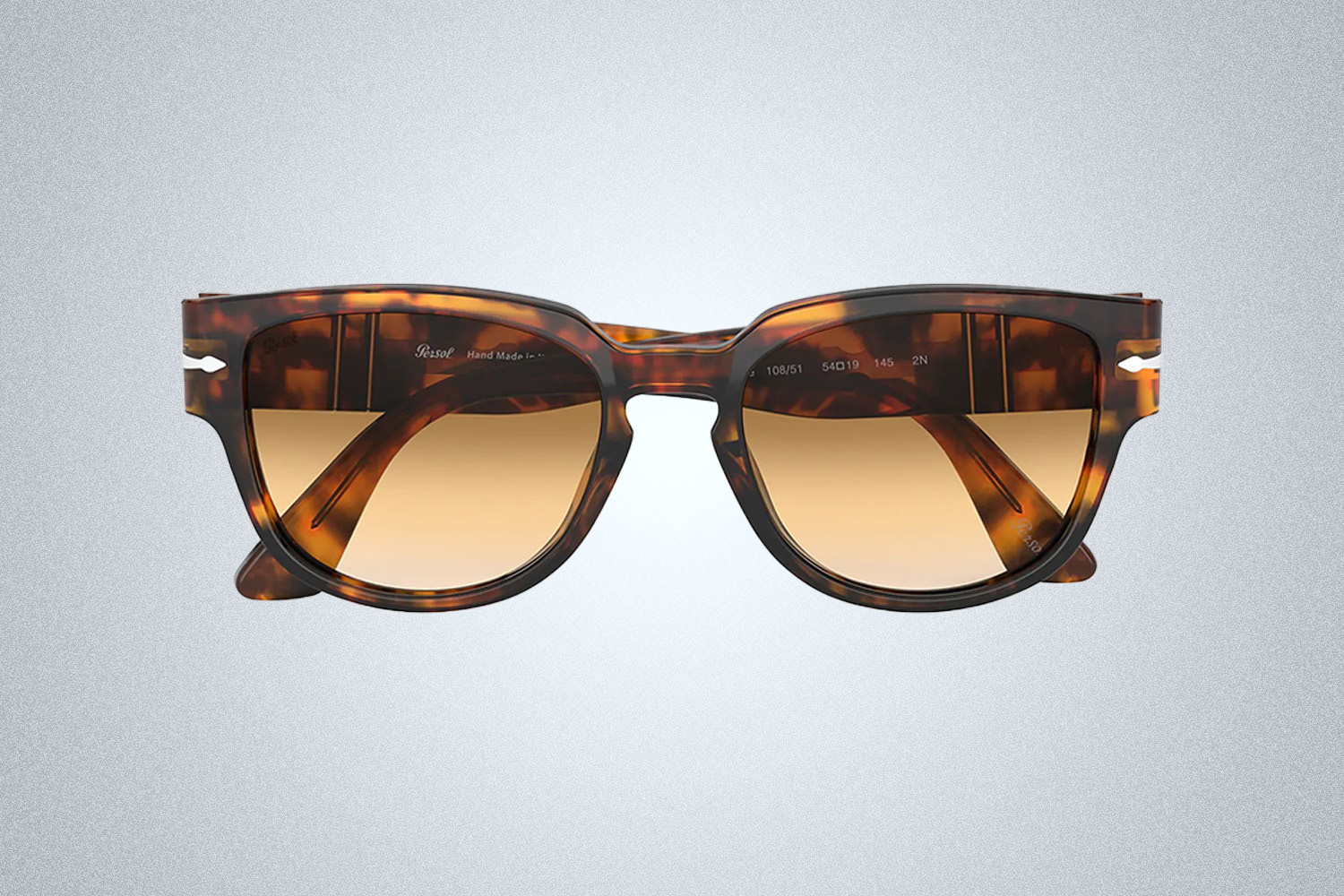 Tortoiseshell square Persol sunglasses on a grey background