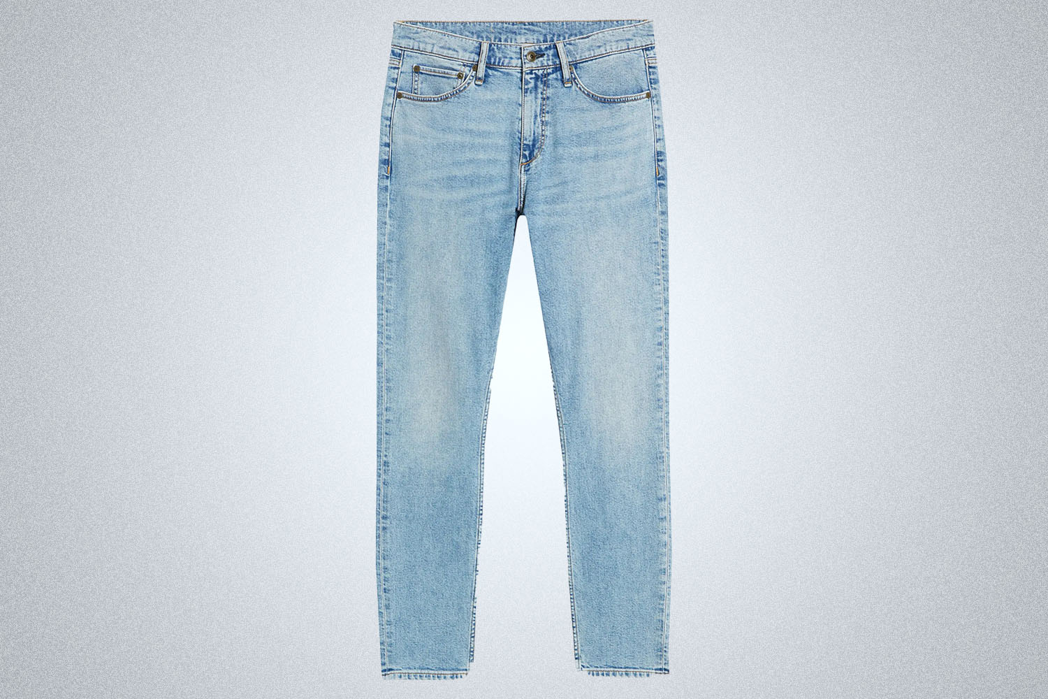 a pair of straight legged, light-wash denim from Rag and Bone on a grey background