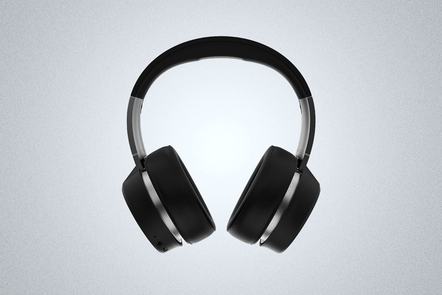 a pair of grey and black headphones on a grey background