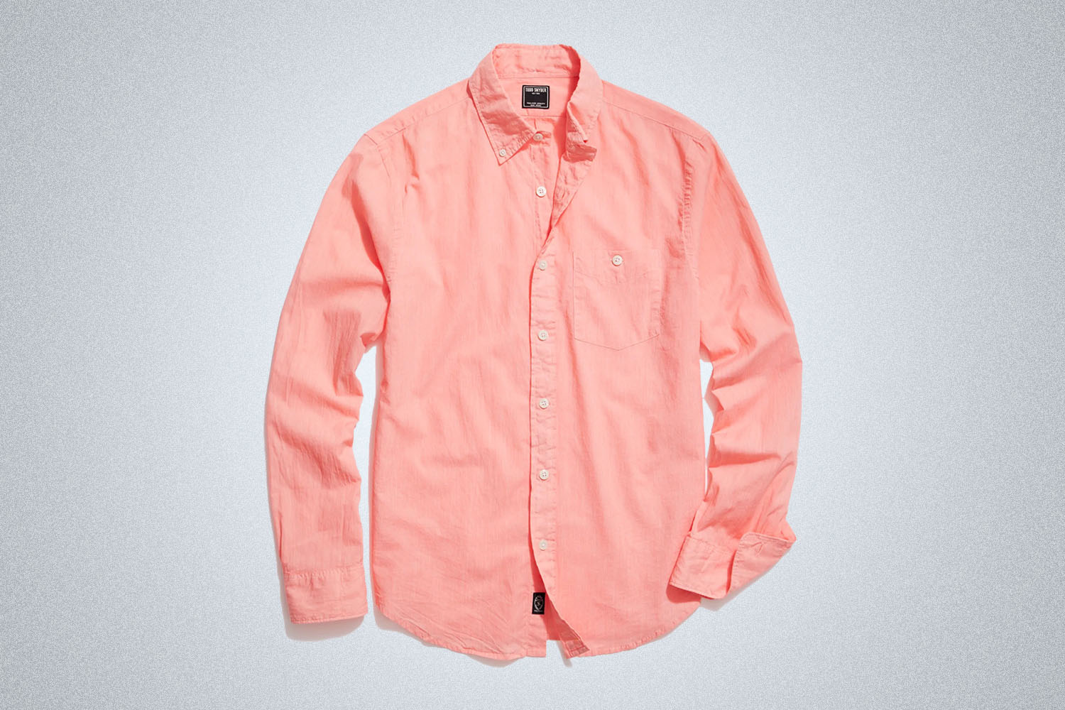 a pink summer weight shirt from Todd Snyder on a grey background