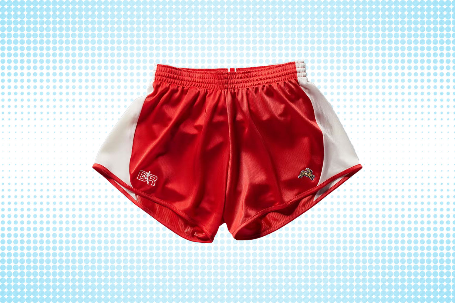 a pair of two-toned white-and-red shorts from Tracksmith on a white and blue dotted background
