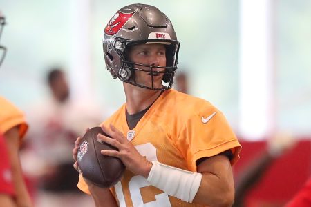 Tom Brady goes through a drill at Tampa Bay's minicamp.