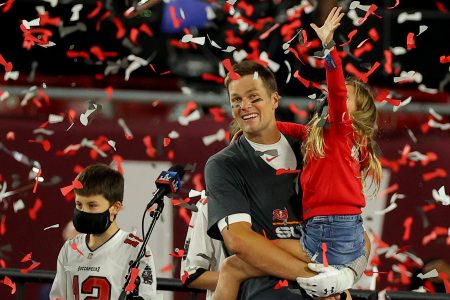 Tom Brady celebrates with two of his kids after defeating the Kansas City Chiefs in Super Bowl LV.