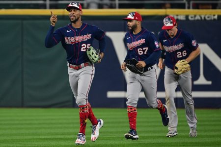 Byron Buxton of the Twins celebrates with Gilberto Celestino and Max Kepler.
