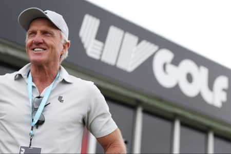 LIV Golf CEO Greg Norman watches play on the driving range