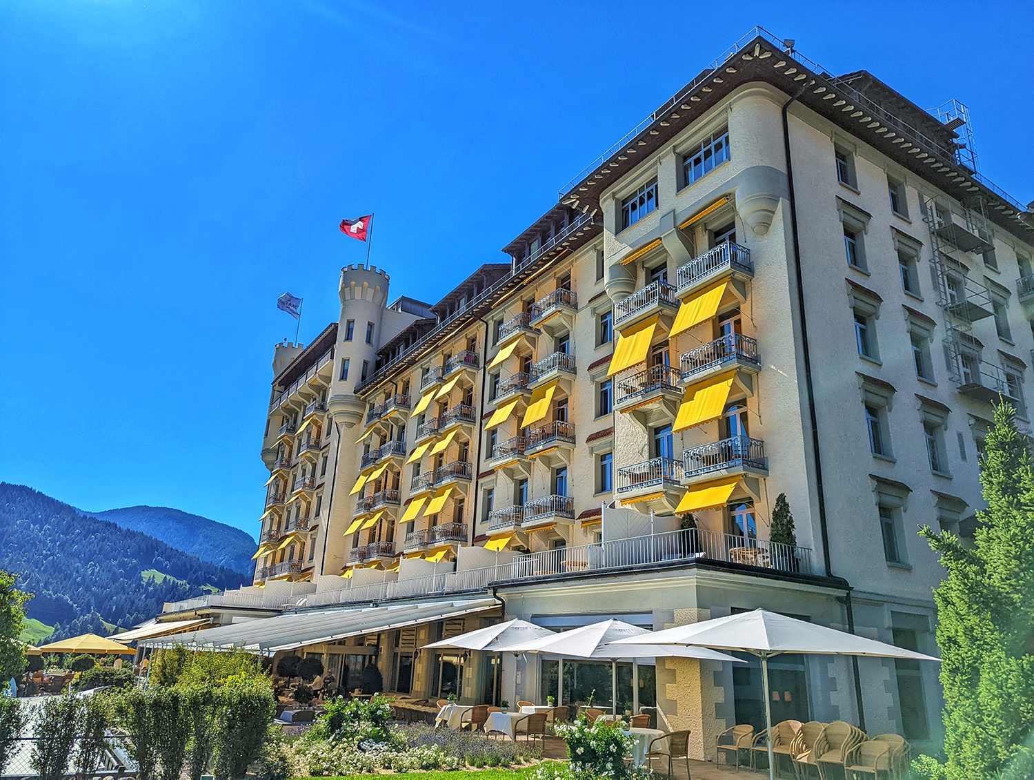 Gstaad Palace in Switzerland on a bright blue summer day