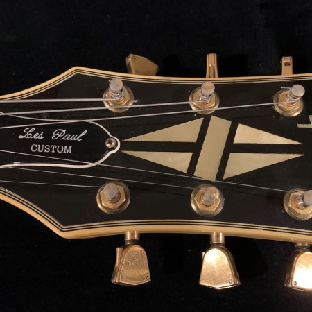 Headstock of a guitar with tuner
