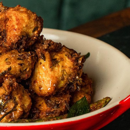 GupShup’s signature fried chicken in a white and red bowl. We got the recipe for the dish.