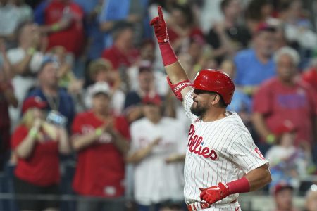 Kyle Schwarber of the Philadelphia Phillies reacts after hitting a solo home run