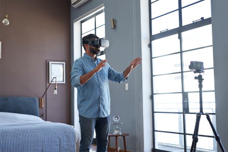 Man in hotel room with VR headset on