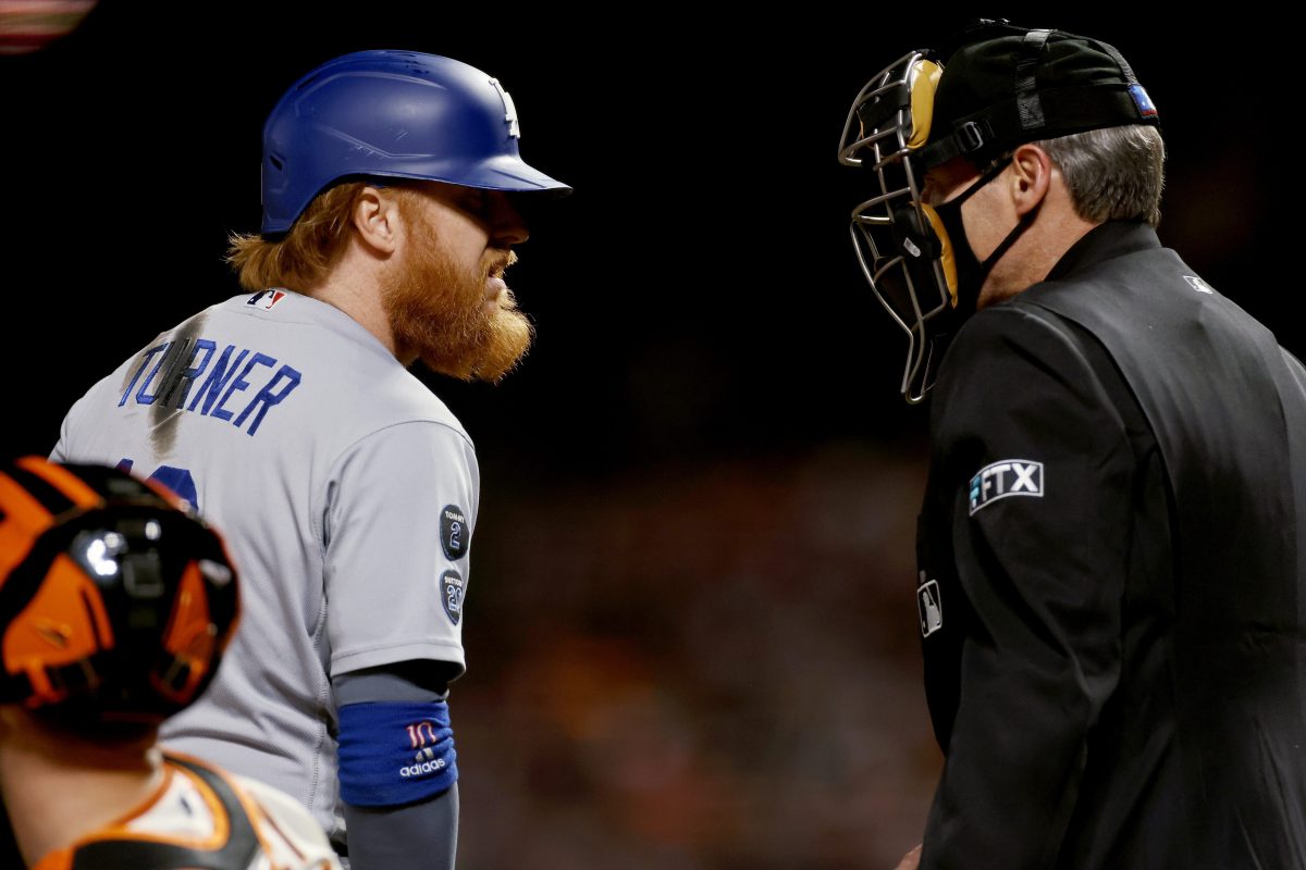 Justin Turner of the Dodgers argues a call with umpire Angel Hernandez