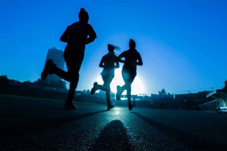 Three people running in the morning. A new study suggests people should exercise far more often than current recommendations.