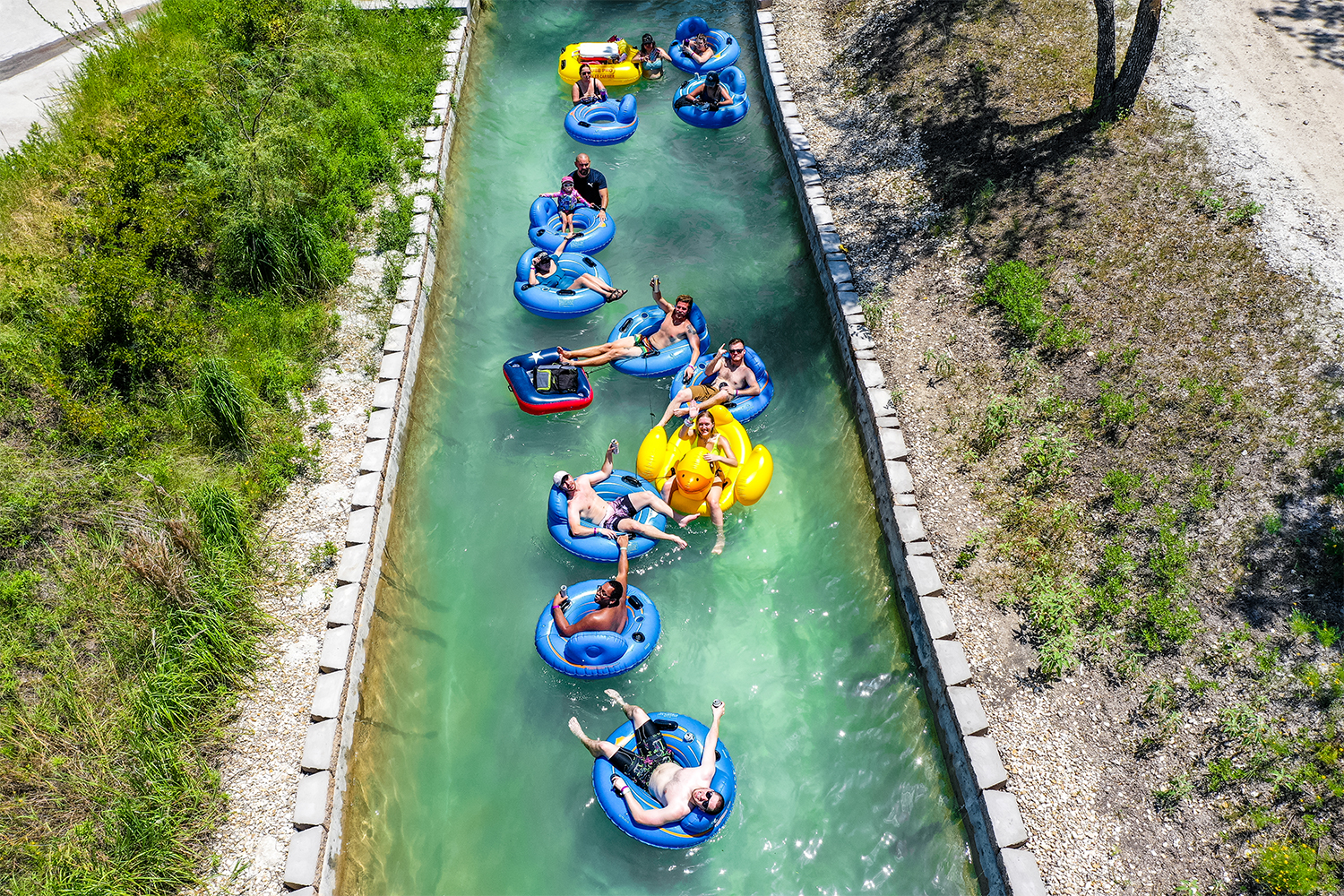 People on inner tubes on the lazy river at Waco Surf in Texas