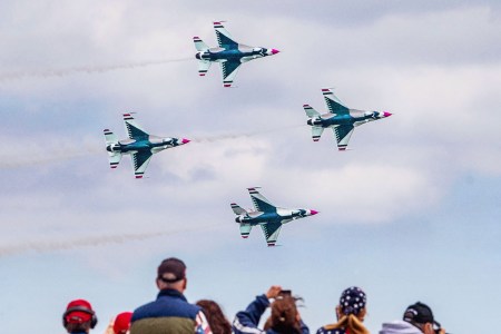 Spectators watch the U.S. Air Force Thunderbirds take to the sky during the Bethpage Air Show at Jones Beach in Wantagh, New York, on May 31, 2021