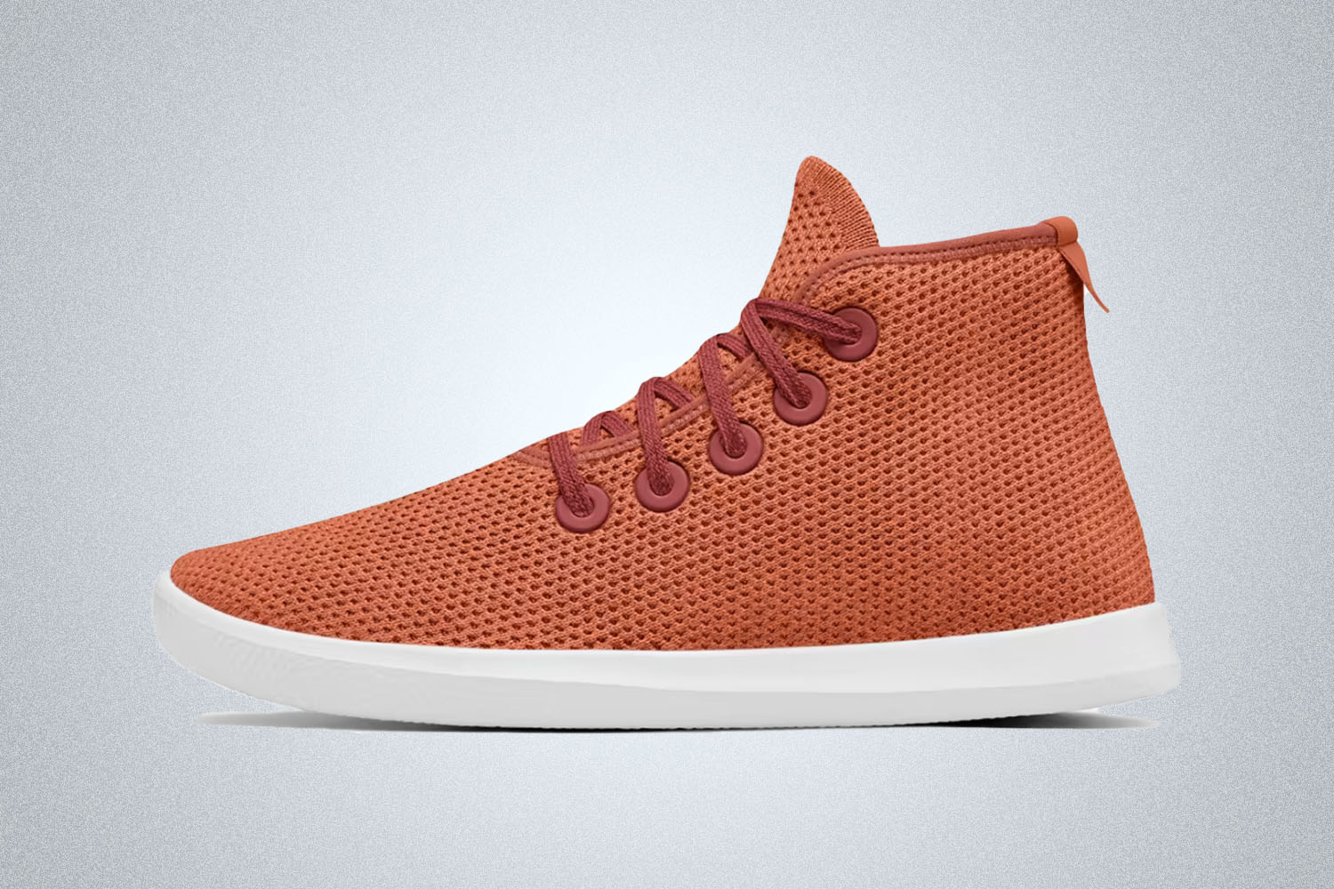 The burnt red Tree Topper sneaker from Allbirds on a grey background