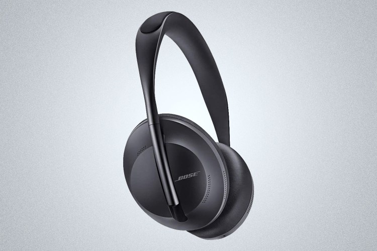A pair of black Bose 700 headphones on a grey background