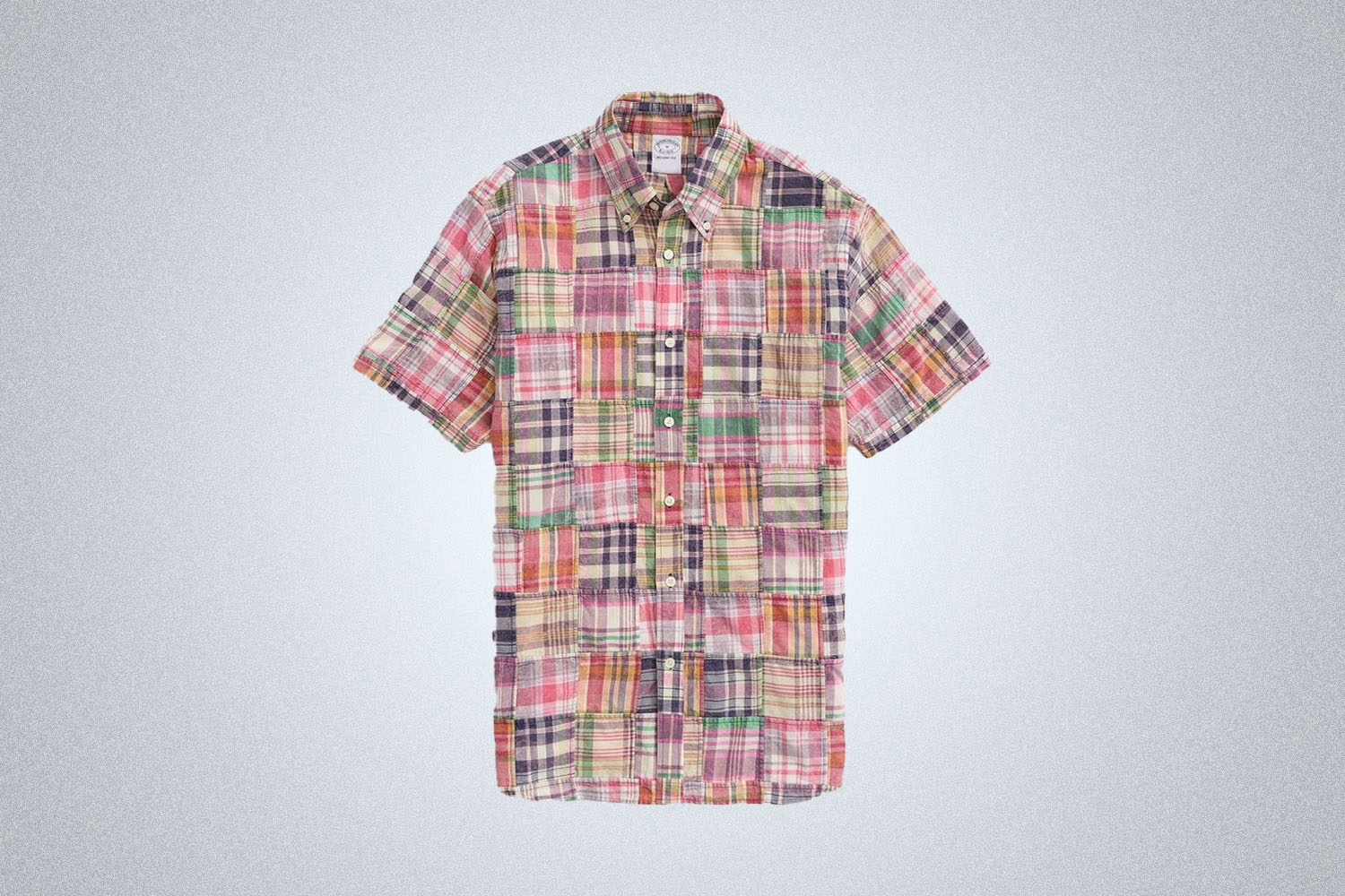 a patchwork madras shirt from Brooks Brothers on a grey background