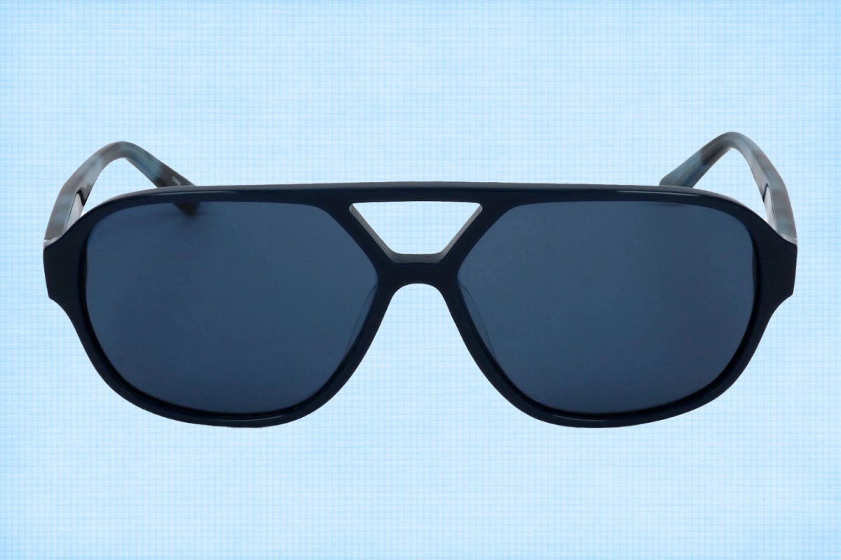 a pair of lbue Calvin Klein Aviator sunglasses on a light blue background