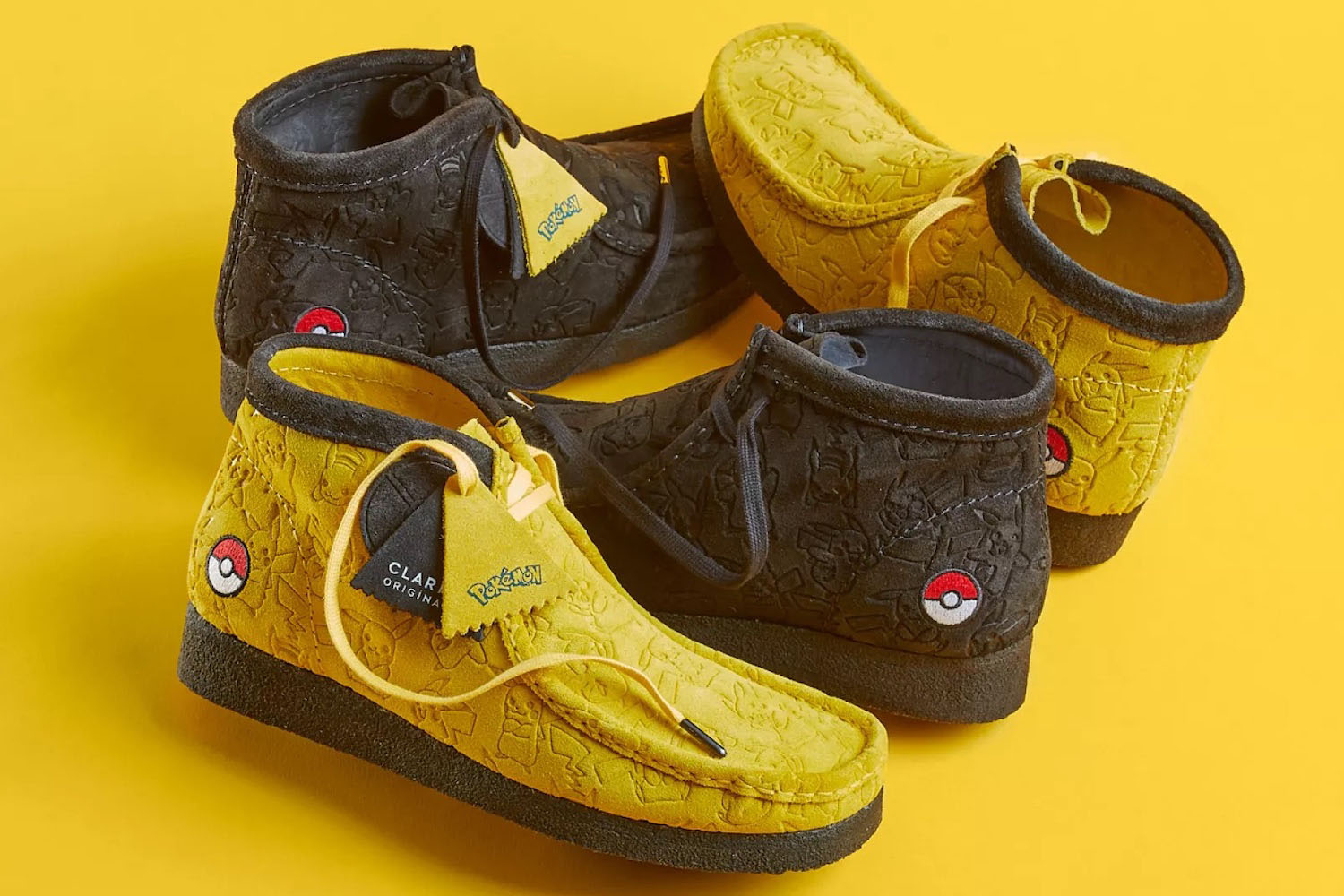 a set of Clarks Wallabee Boots with Pokemon branding on a yellow background
