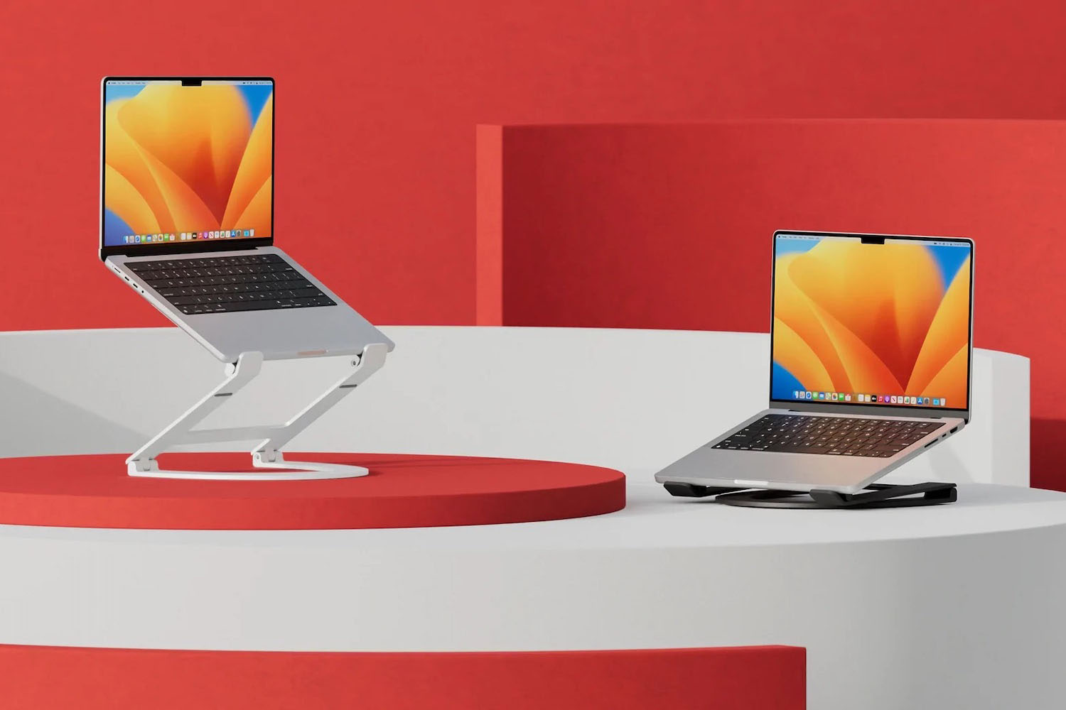 two apple laptops on a flex curve stands on a red background