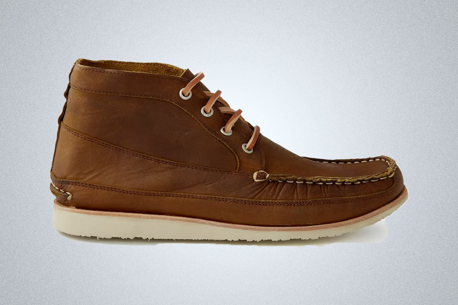 A brown leather Chukka boot from Easymoc on a grey background