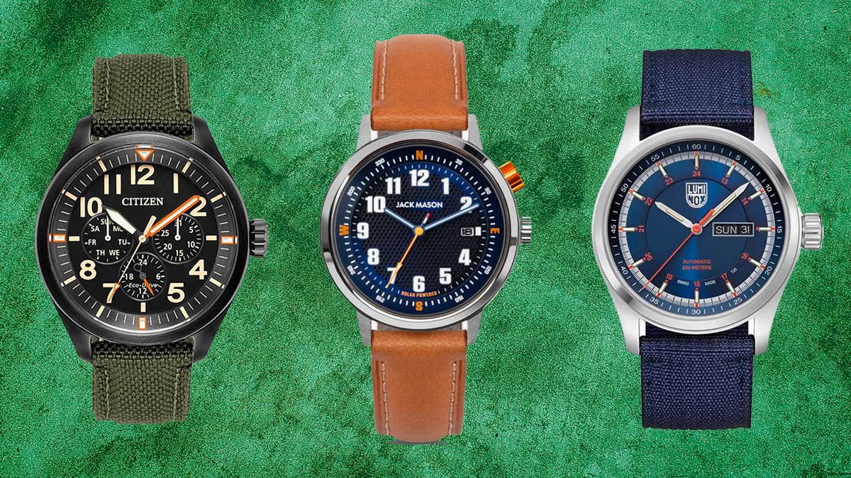 Three field watches on a green background.