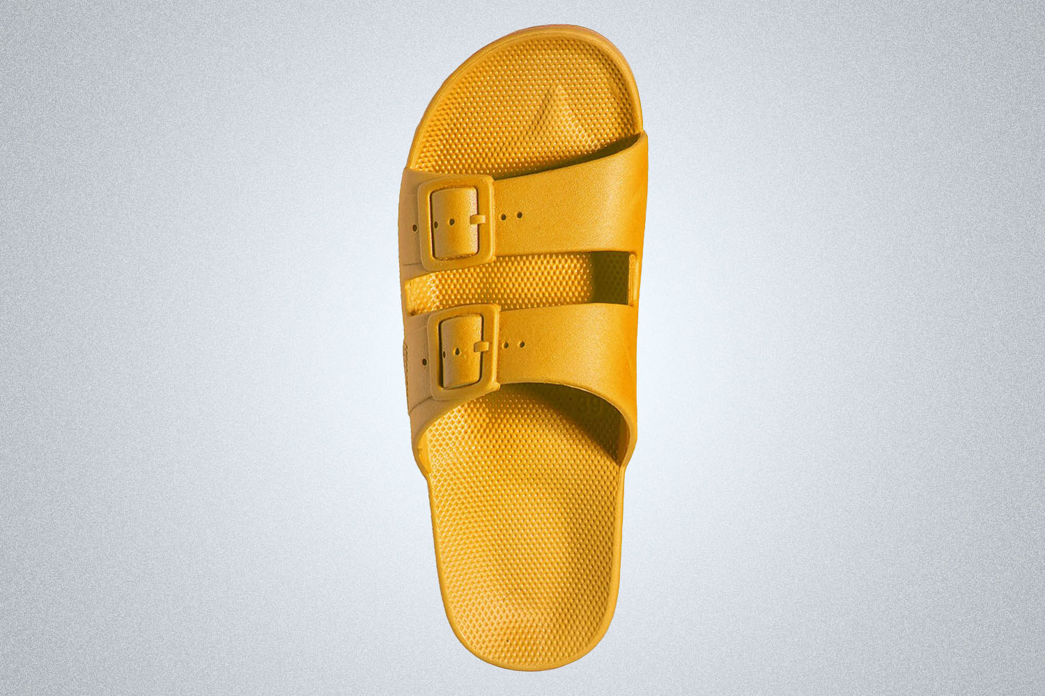 a yellow two-band Freedom Moses slide on a grey background